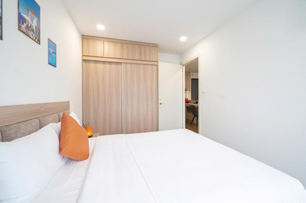 Postel nebo postele na pokoji v ubytování Luxe Paradise Hotel Nguyen Khac Hieu