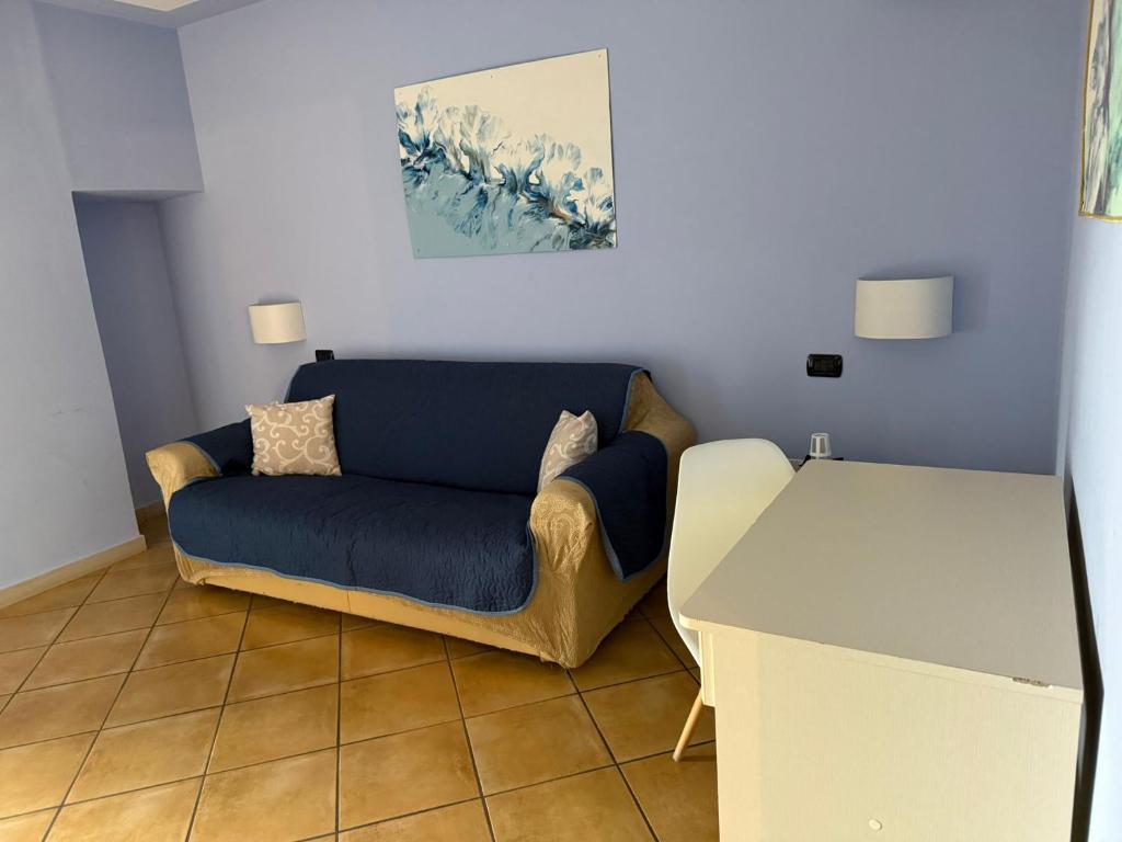 a living room with a couch and a table at Luna Convento Copanello B&B in Stalettì