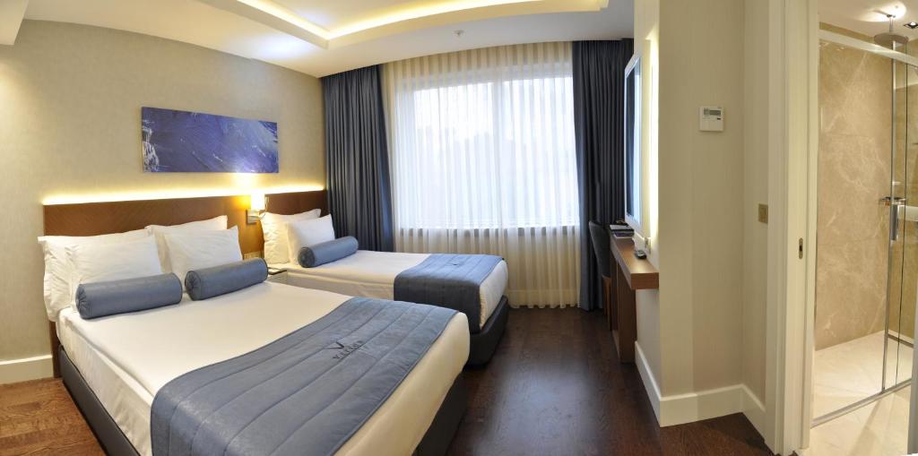 Postel nebo postele na pokoji v ubytování Veyron Hotels & SPA