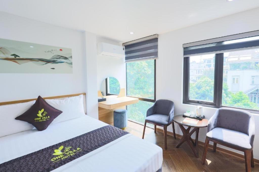 Ένα ή περισσότερα κρεβάτια σε δωμάτιο στο One Villa 4 Hotel