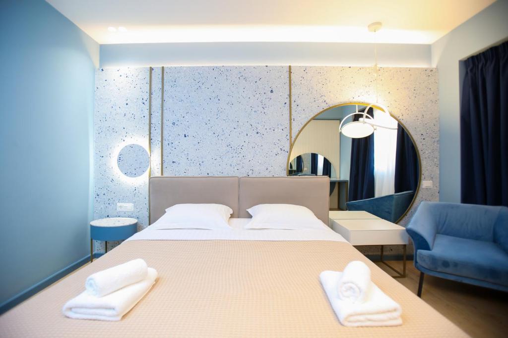 Postel nebo postele na pokoji v ubytování Imperial Visar Rooms