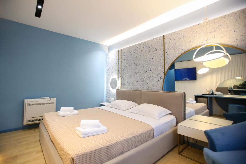 Postel nebo postele na pokoji v ubytování Imperial Visar Rooms