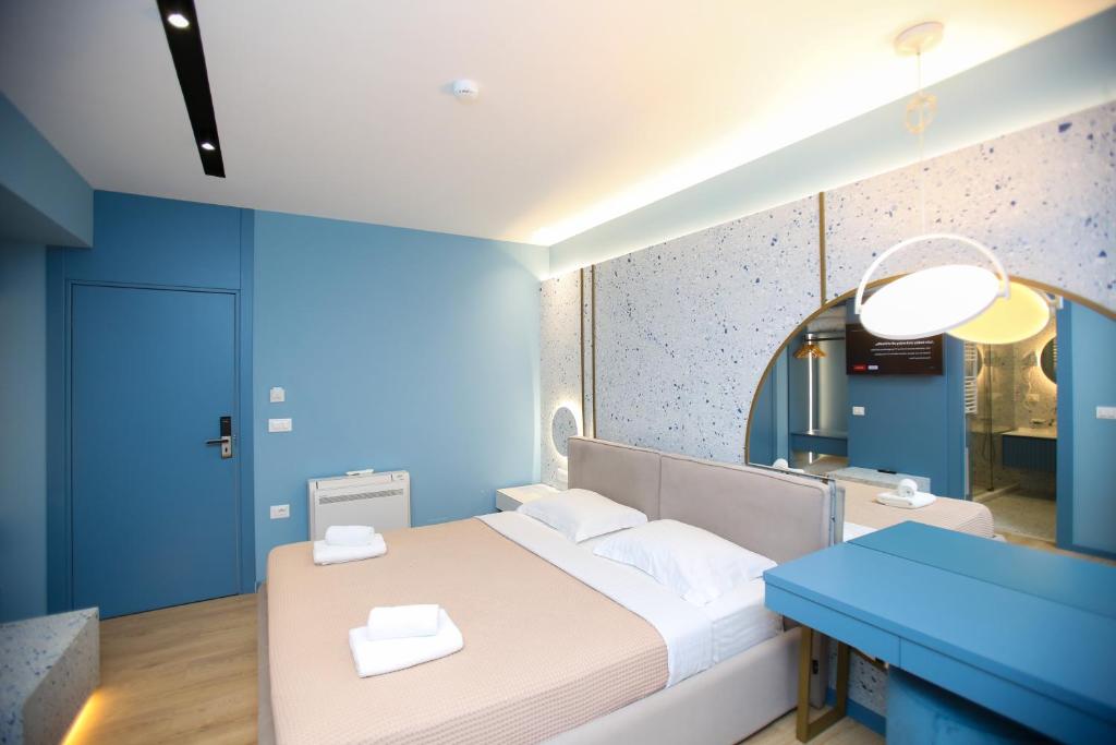 Postel nebo postele na pokoji v ubytování Imperial Visar Rooms