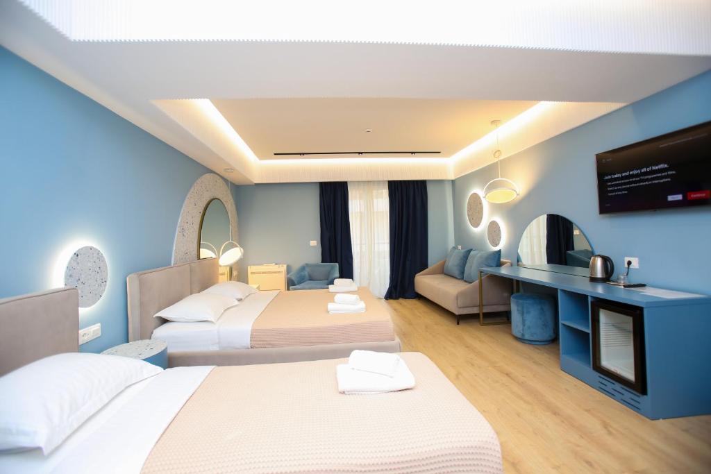 Postel nebo postele na pokoji v ubytování Imperial Visar Rooms