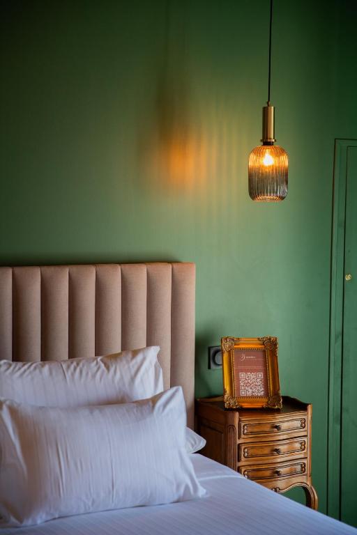 Postel nebo postele na pokoji v ubytování Maison Roucas - Restaurant et chambres d'hôtes