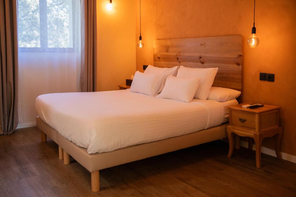 Postel nebo postele na pokoji v ubytování Maison Roucas - Restaurant et chambres d'hôtes
