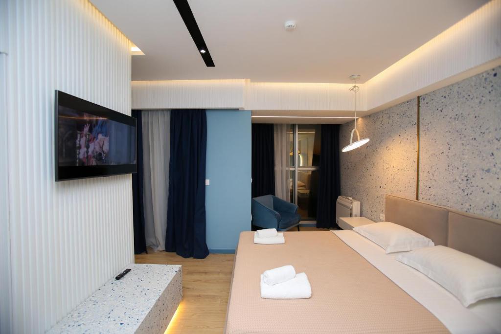 Postel nebo postele na pokoji v ubytování Imperial Visar Rooms