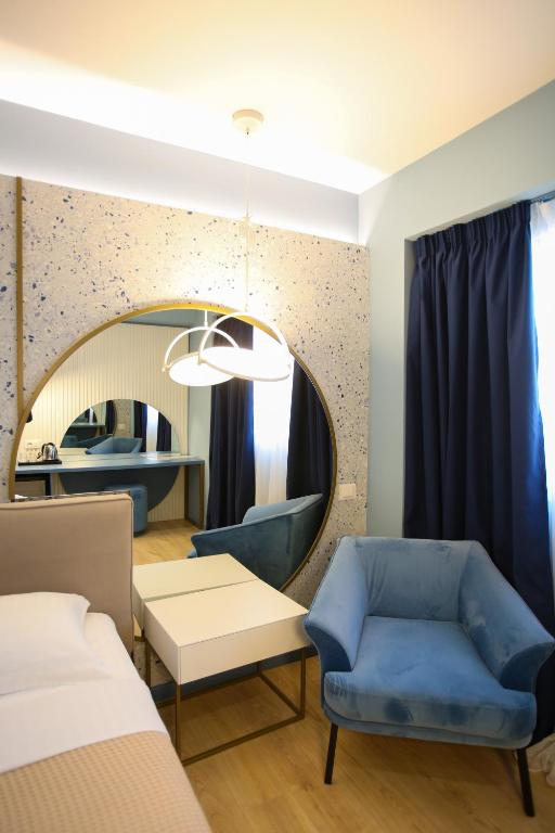 Postel nebo postele na pokoji v ubytování Imperial Visar Rooms