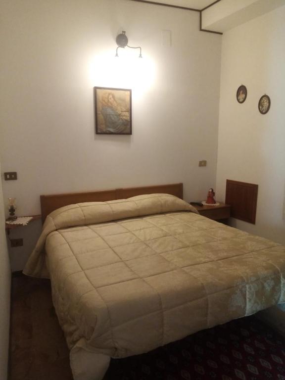 Postel nebo postele na pokoji v ubytování Albergo Andromeda