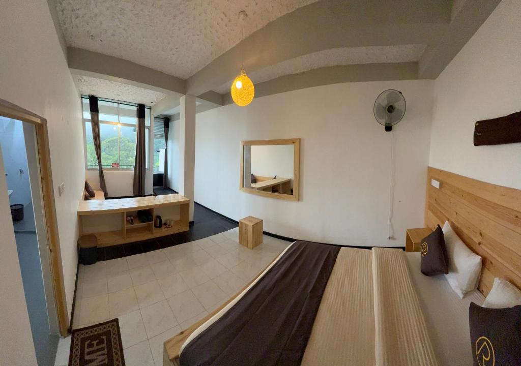 Postel nebo postele na pokoji v ubytování Rawana View Ella