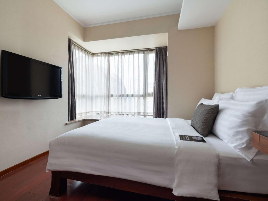 Postel nebo postele na pokoji v ubytování Pullman Oceanview Sanya Bay Resort & Spa