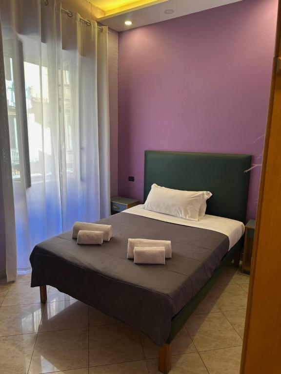 Postel nebo postele na pokoji v ubytování Smart Station Hotel