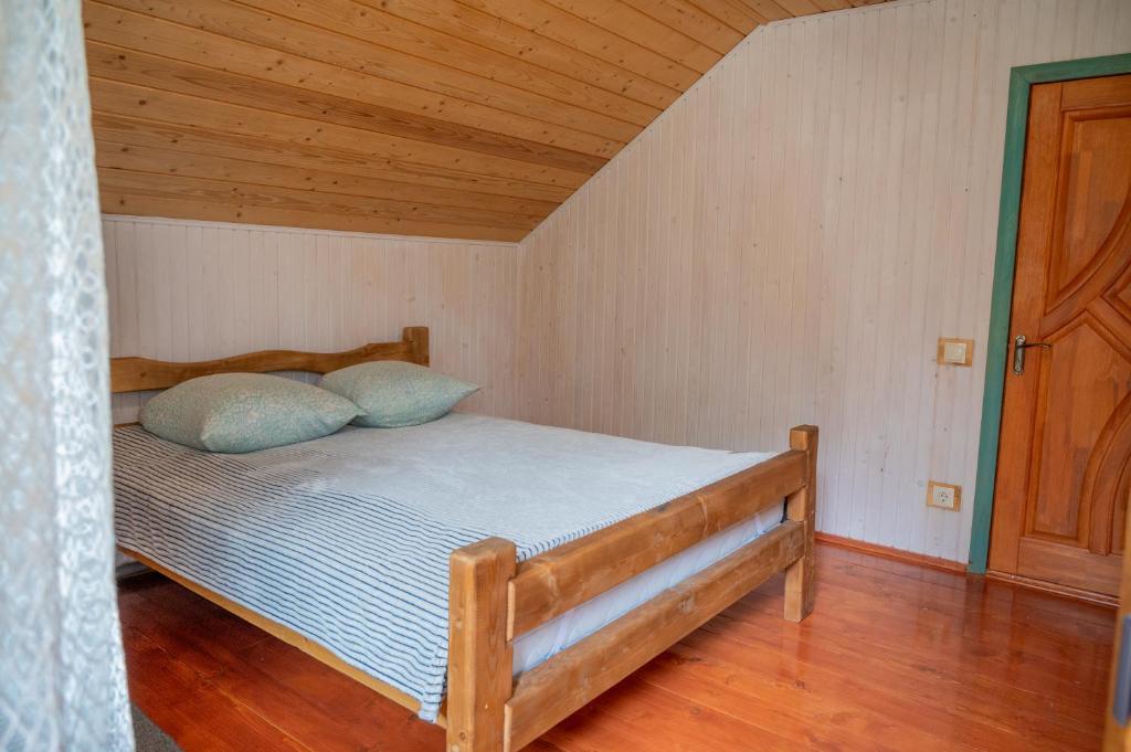 Postel nebo postele na pokoji v ubytování Садиба Кичера