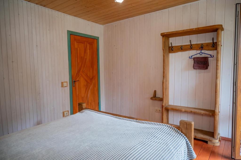 Postel nebo postele na pokoji v ubytování Садиба Кичера