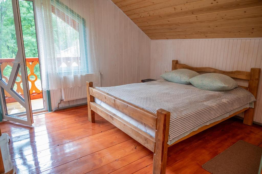 Postel nebo postele na pokoji v ubytování Садиба Кичера