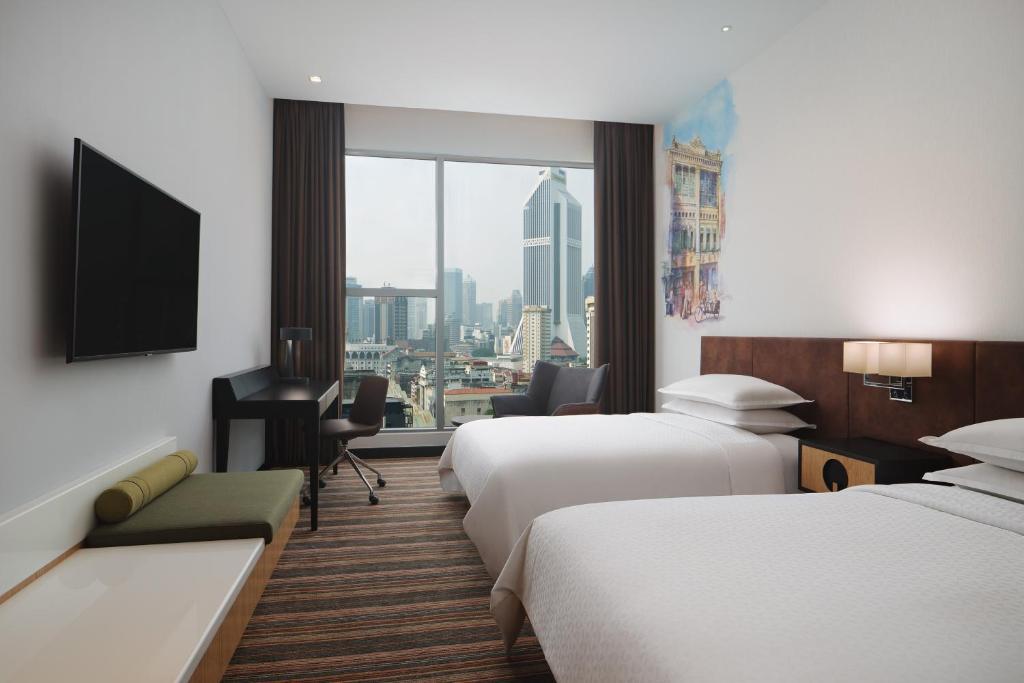 Postel nebo postele na pokoji v ubytování Four Points by Sheraton Kuala Lumpur, Chinatown