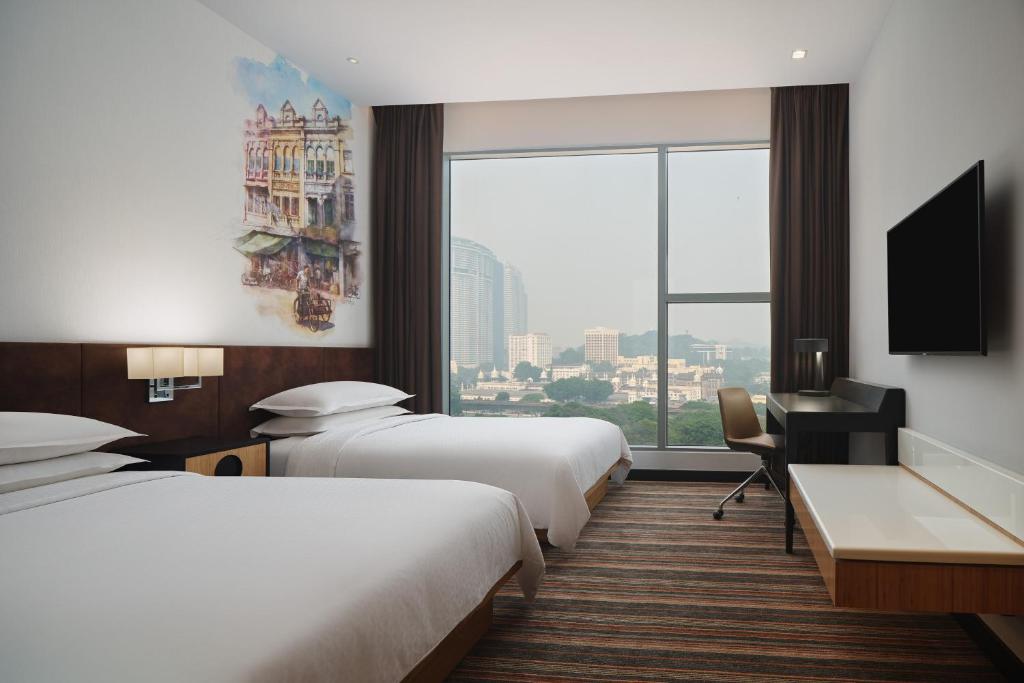 Postel nebo postele na pokoji v ubytování Four Points by Sheraton Kuala Lumpur, Chinatown