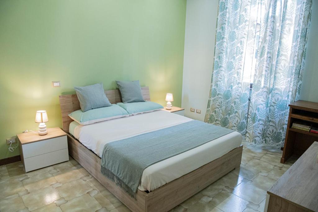 Ένα ή περισσότερα κρεβάτια σε δωμάτιο στο RHome City Garden