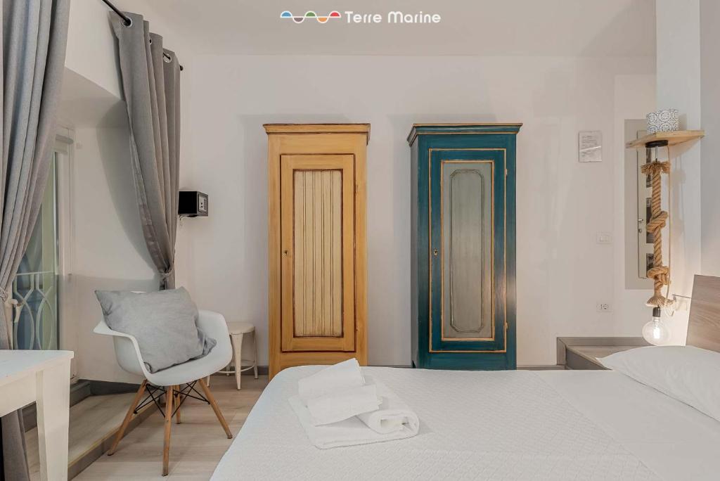 Postel nebo postele na pokoji v ubytování I Profumi del Mare, Terre Marine
