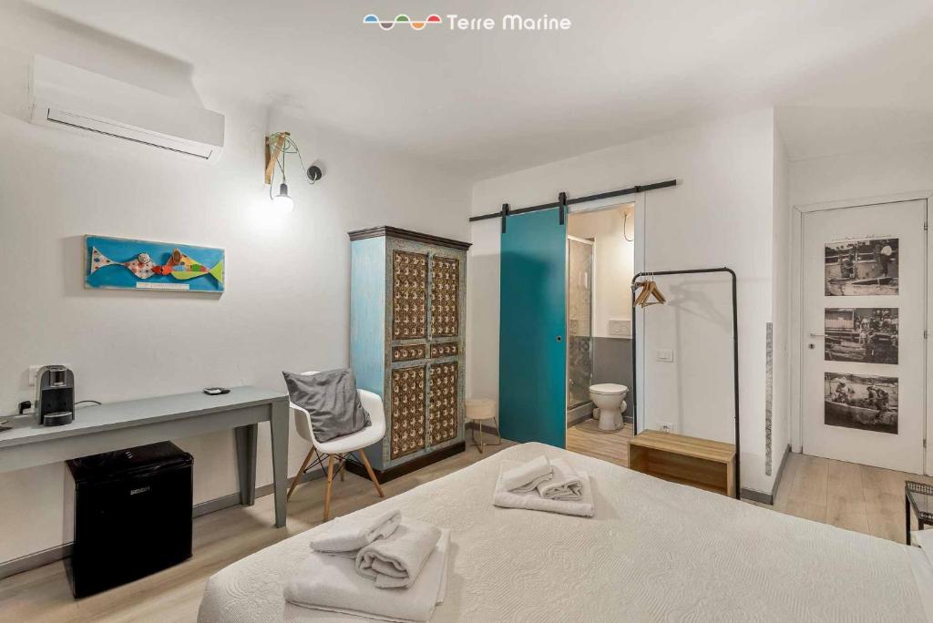 Postel nebo postele na pokoji v ubytování I Profumi del Mare, Terre Marine