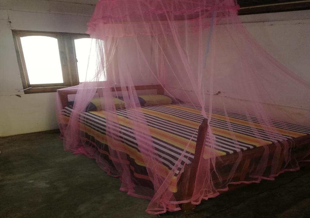 Postel nebo postele na pokoji v ubytování Skykite Resort & Hostel Kalpitiya Sri Lanka