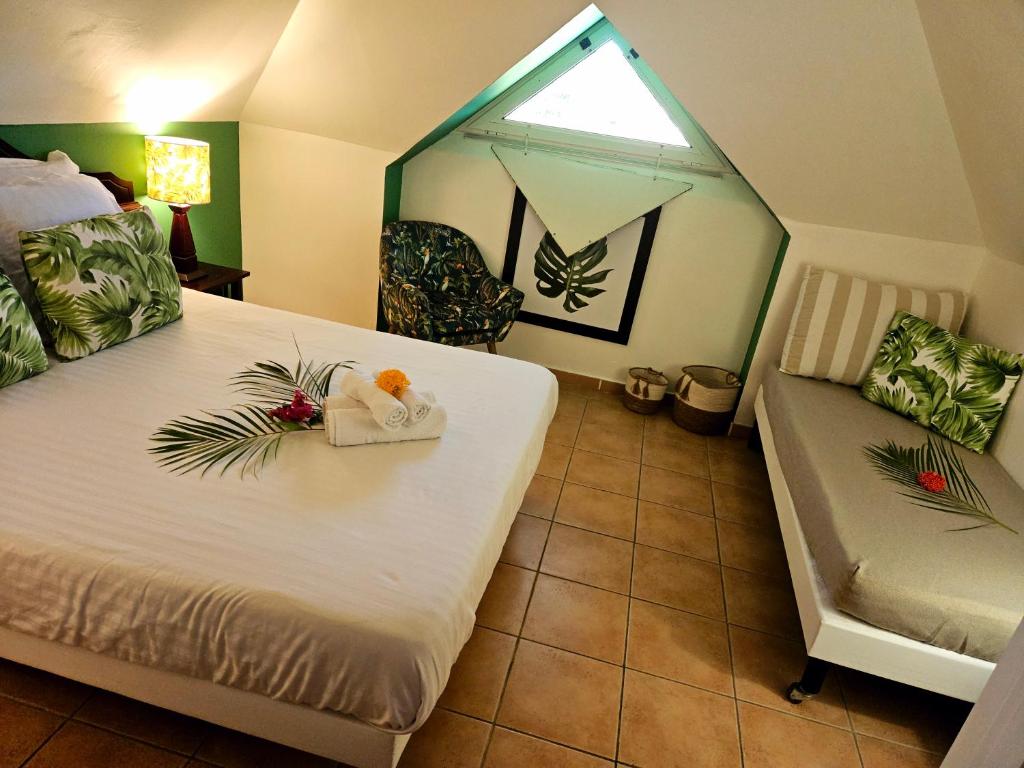 Postel nebo postele na pokoji v ubytování TI OASIS Dominica - Pierre et Vacances - Piscine et Plage - 1 chambre 1 salon