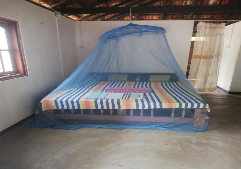 Postel nebo postele na pokoji v ubytování Skykite Resort & Hostel Kalpitiya Sri Lanka