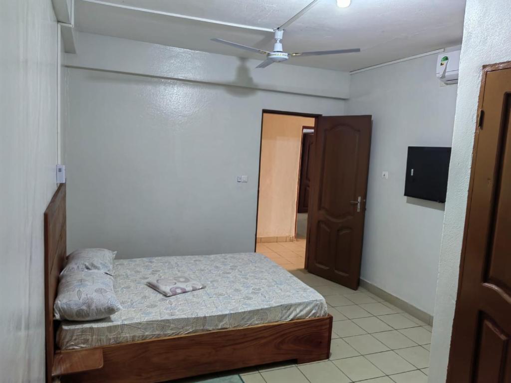 Postel nebo postele na pokoji v ubytování Tadagbe Appart Studio1