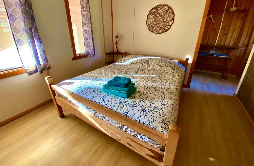Postel nebo postele na pokoji v ubytování Hostal Las Natalias