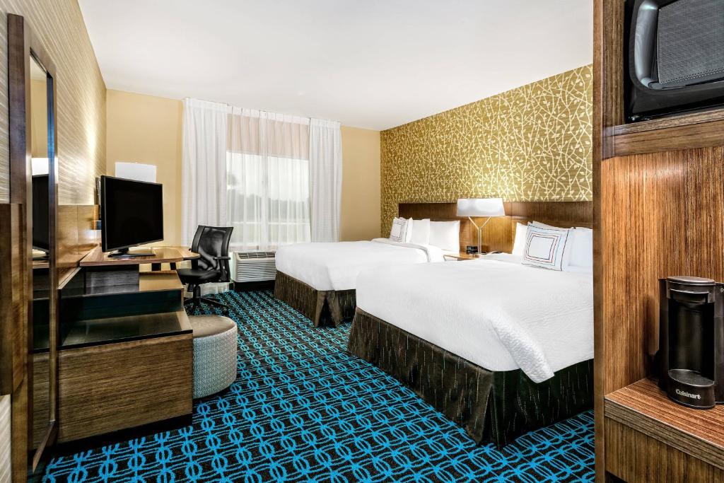 a hotel room with two beds and a television at Fairfield Inn & Suites by Marriott Van in Van