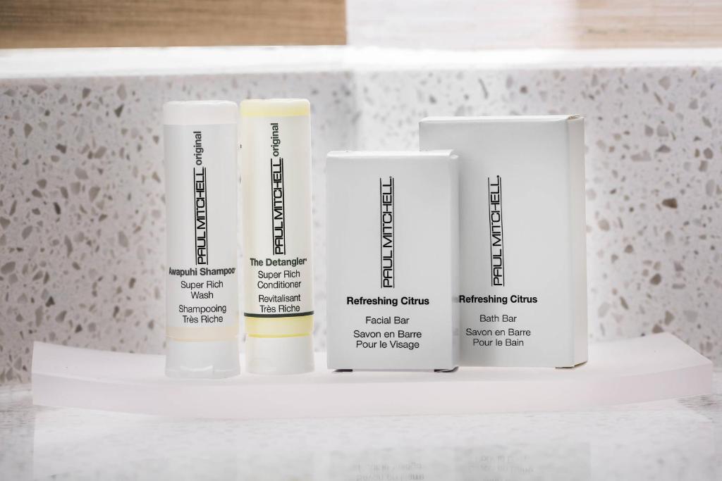 four bottles of moisturizers sitting on a shelf at Fairfield Inn & Suites by Marriott Van in Van