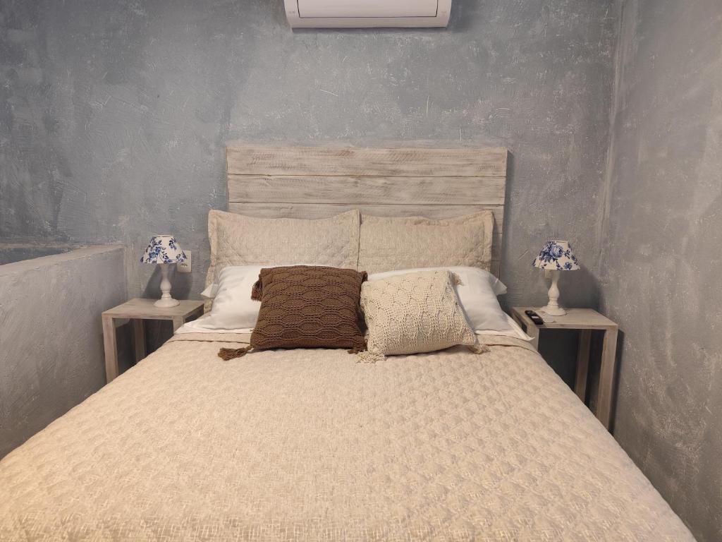 Cama ou camas em um quarto em Pousada Hospedaria215