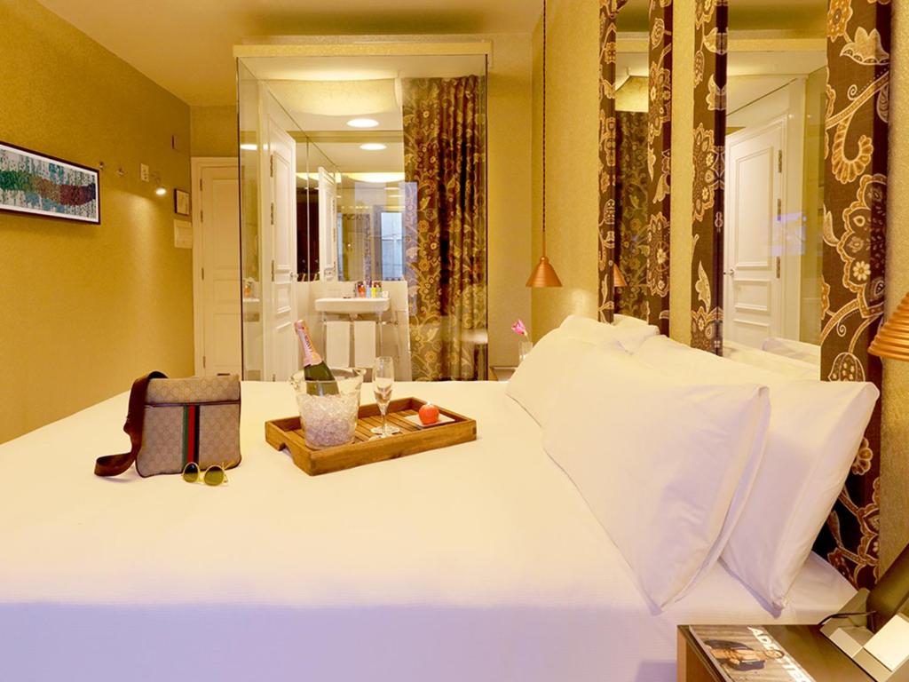A bed or beds in a room at Axel Hotel Barcelona - Adults Only