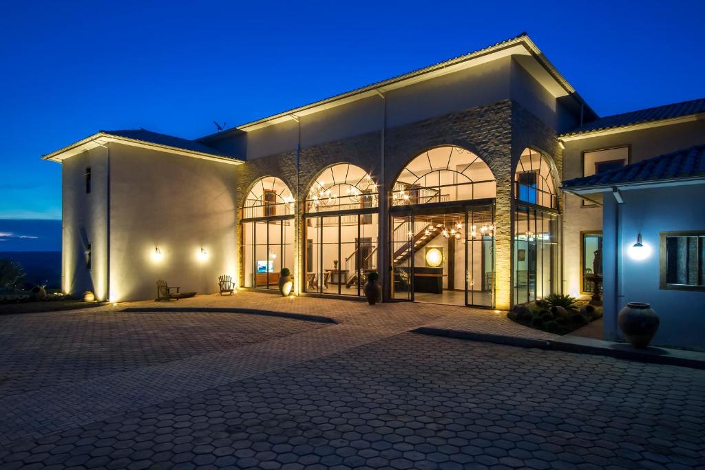 a large building with large windows at night at Solar Da Serra Tiradentes in Tiradentes