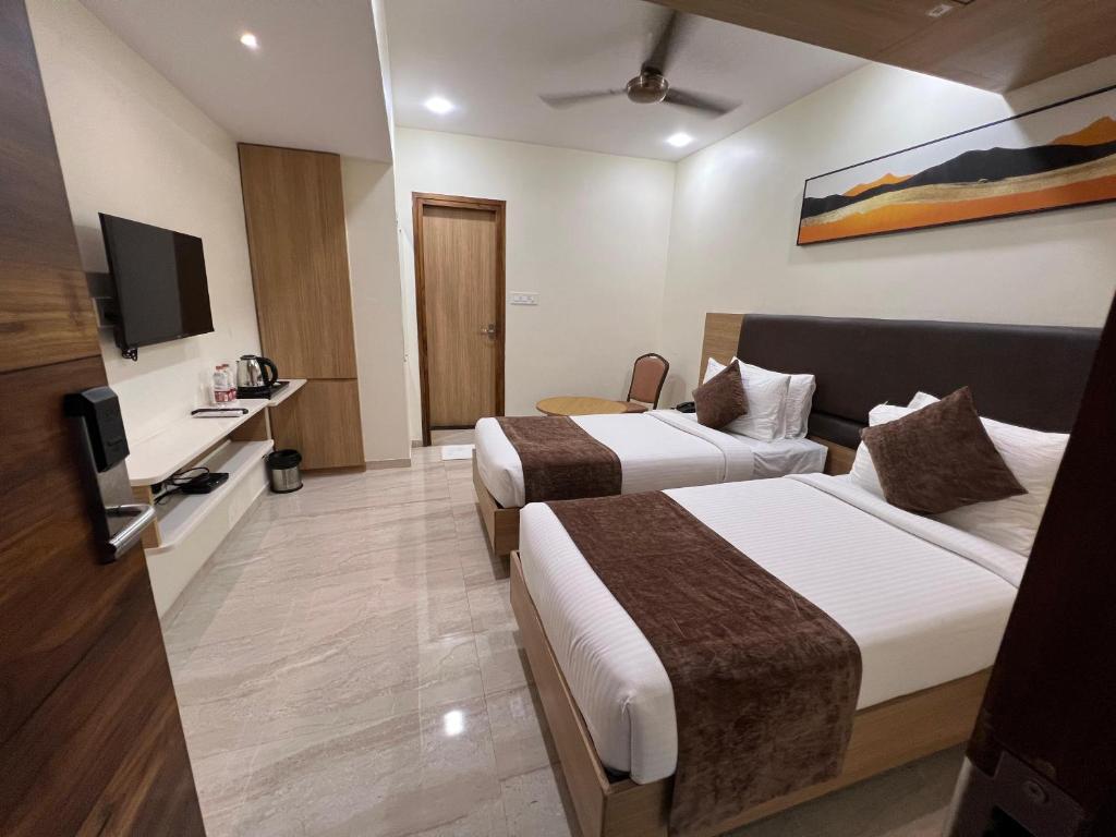 Postel nebo postele na pokoji v ubytování HOTEL TOUCHWOOD