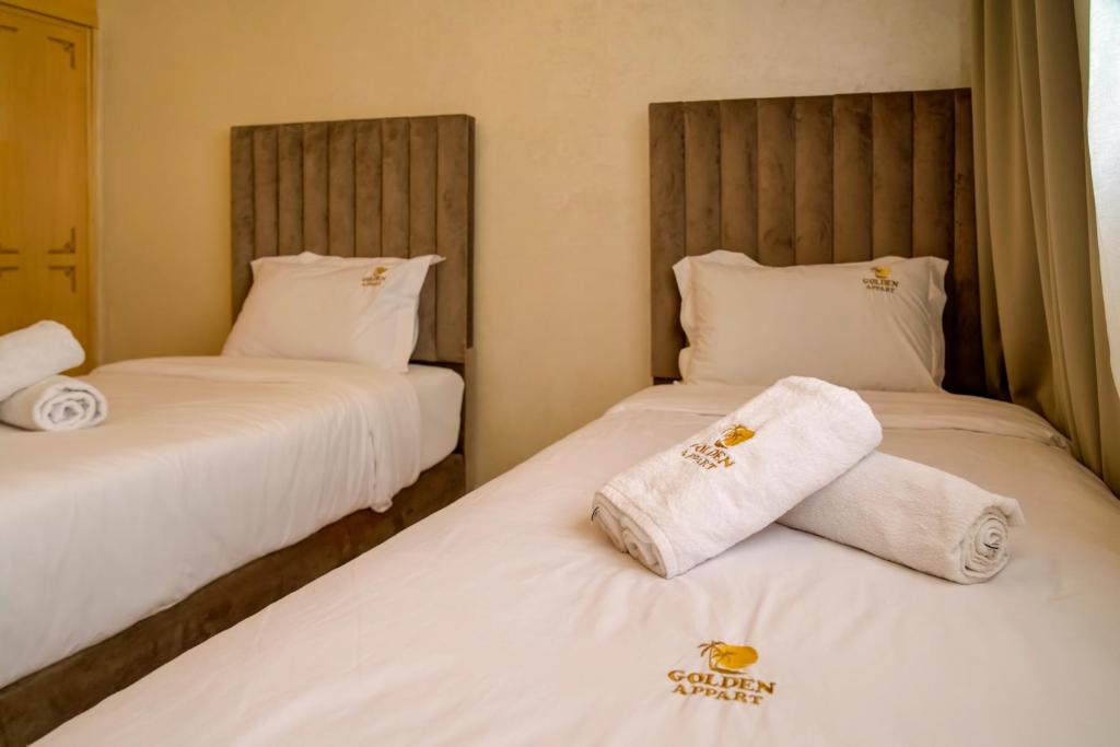Postel nebo postele na pokoji v ubytování Golden Appartement Agadir