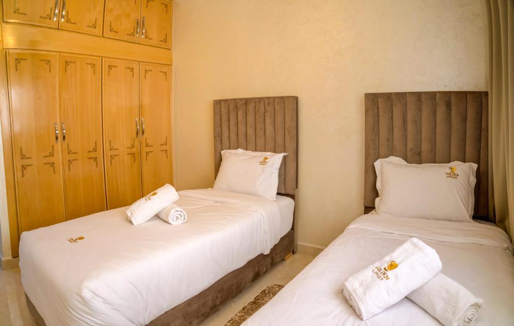 Postel nebo postele na pokoji v ubytování Golden Appartement Agadir