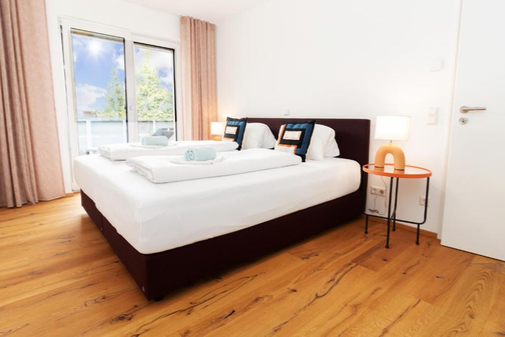Postel nebo postele na pokoji v ubytování HEIMATEL - Bodensee Residenz Allgäu