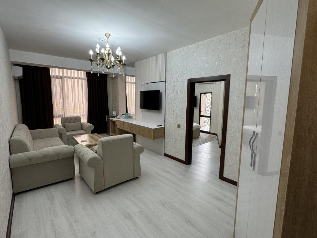 TV a/nebo společenská místnost v ubytování Aram Hotel