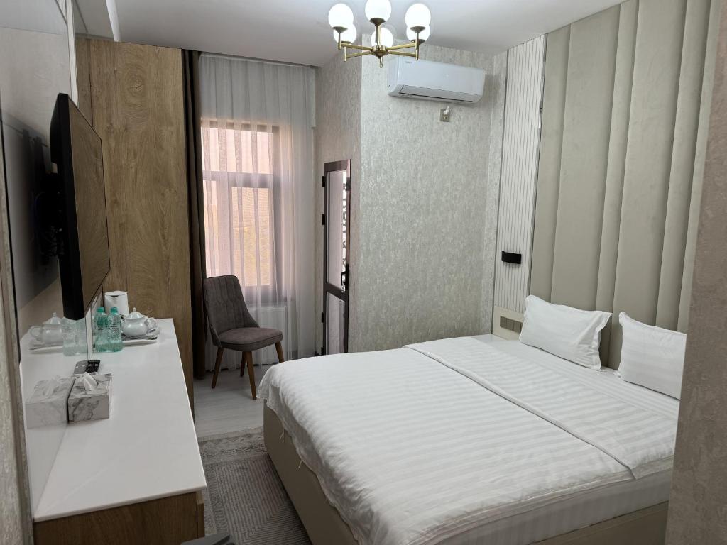 Postel nebo postele na pokoji v ubytování Aram Hotel
