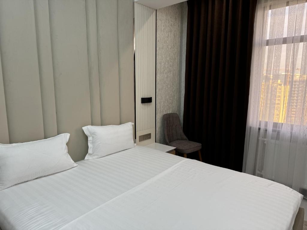 Postel nebo postele na pokoji v ubytování Aram Hotel