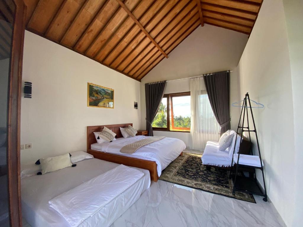 Postel nebo postele na pokoji v ubytování Dira Bungalows