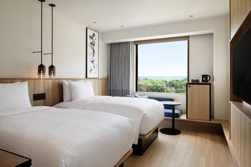 Postel nebo postele na pokoji v ubytování Fairfield by Marriott Mie Kumano Kodo Mihama