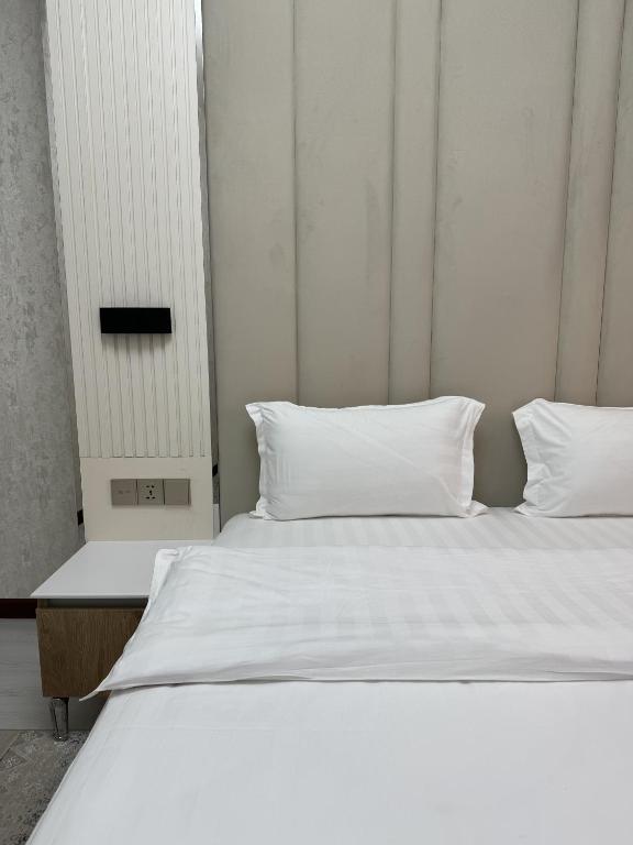 Postel nebo postele na pokoji v ubytování Aram Hotel