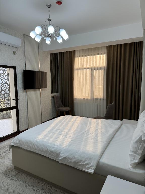 Postel nebo postele na pokoji v ubytování Aram Hotel