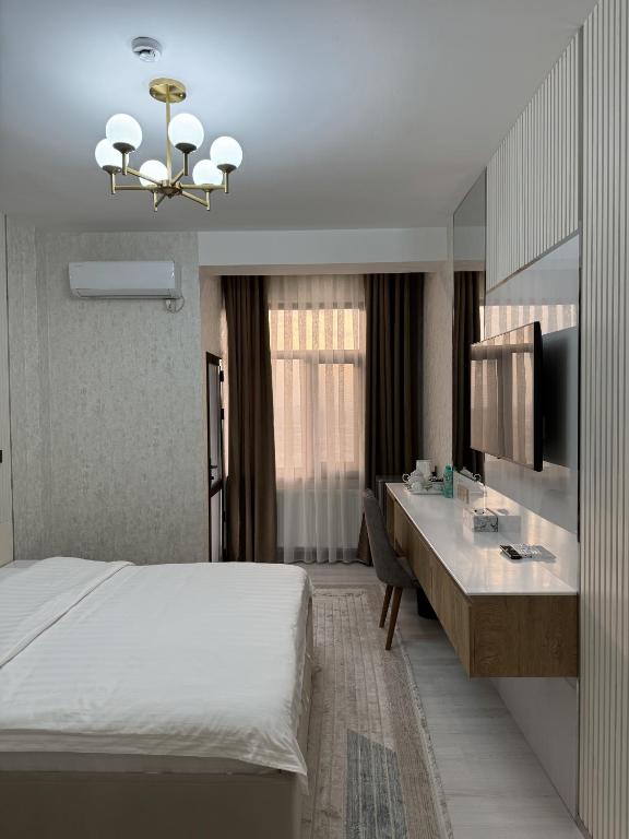 Postel nebo postele na pokoji v ubytování Aram Hotel