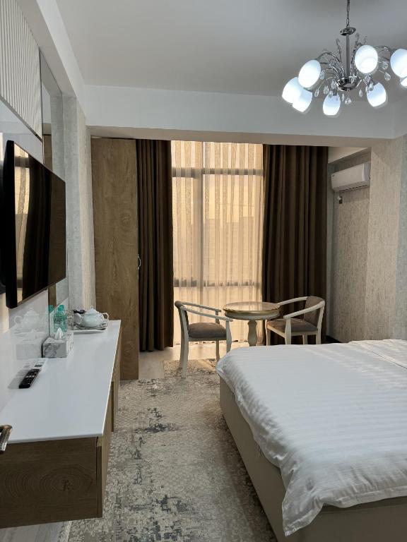 Postel nebo postele na pokoji v ubytování Aram Hotel