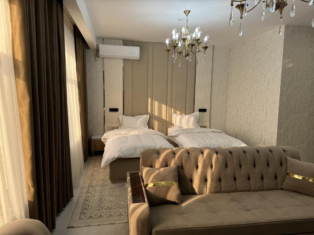 Postel nebo postele na pokoji v ubytování Aram Hotel