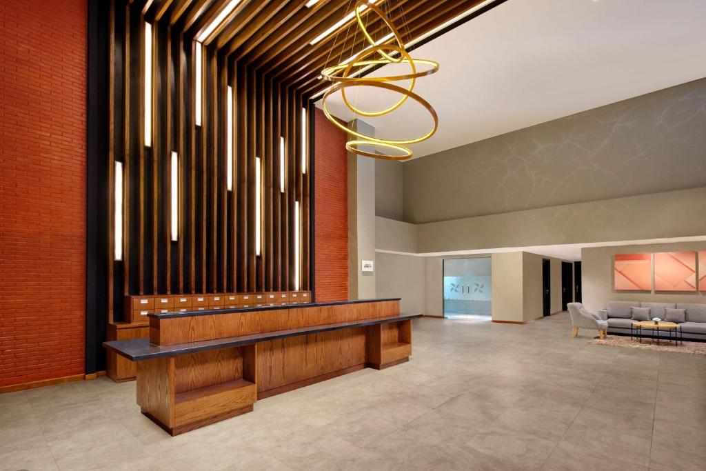 an organ in a lobby with a large pipe organ at Four Points by Sheraton Balikpapan in Balikpapan