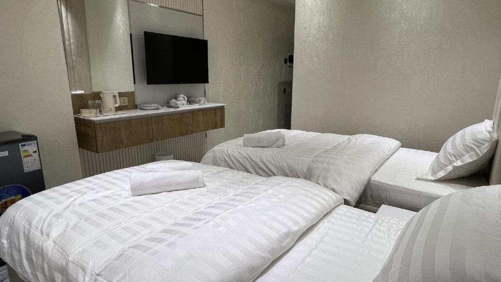Postel nebo postele na pokoji v ubytování Aram Hotel